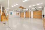 This spacious garage offers ample room for vehicles and storage.