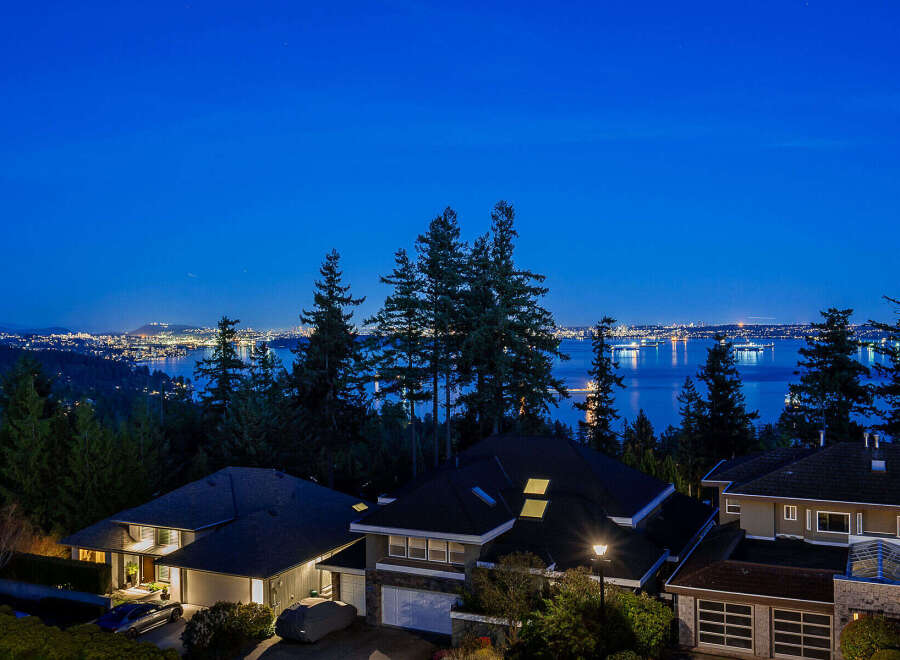 Experience luxury living with this stunning property boasting breathtaking views of the city skyline and serene waters.