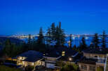 Experience luxury living with this stunning property boasting breathtaking views of the city skyline and serene waters.
