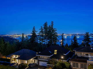 Experience luxury living with this stunning property boasting breathtaking views of the city skyline and serene waters.