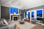 Step into luxury with this stunning living room, boasting a cozy fireplace and elegant design.