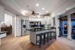 This stunning kitchen boasts a modern design with sleek stainless steel appliances and a spacious island perfect for entertaining.