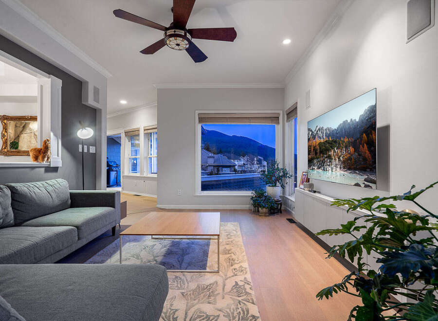 Experience luxury living in this stunning property, featuring a spacious living room with a modern design.