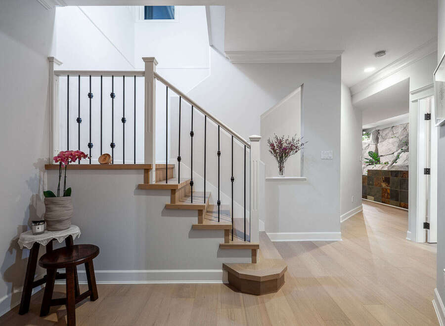 Step into luxury with this stunning property featuring a beautifully designed staircase.
