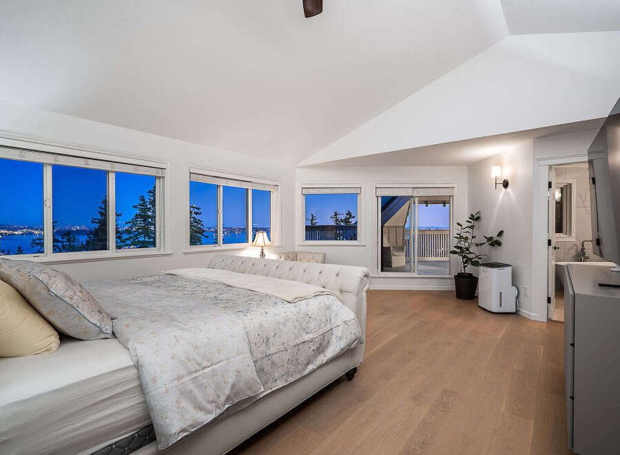 Experience luxury living in this stunning bedroom with breathtaking views.