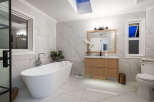 Step into luxury with this stunning bathroom featuring a modern design and high-end finishes.