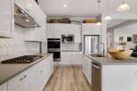 This stunning kitchen boasts modern design and functionality, perfect for culinary enthusiasts.