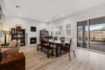 This stunning property boasts a spacious living area with a cozy fireplace, perfect for relaxing evenings.