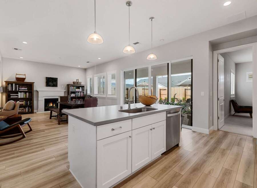 This stunning kitchen boasts a modern design with a spacious island, perfect for meal preparation and entertaining.