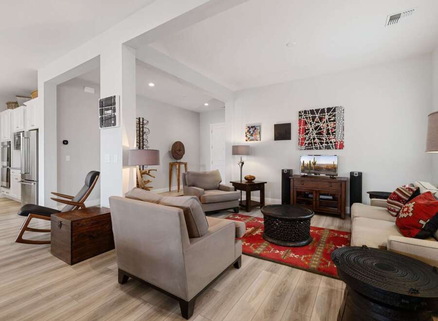 Step into luxury with this stunning living room, featuring a modern design and ample space for relaxation.