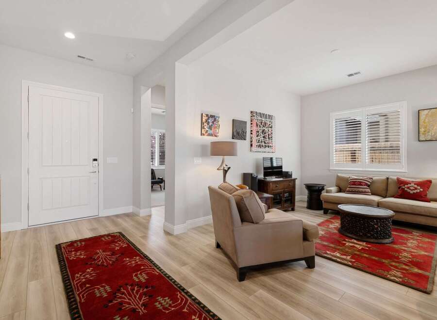 Step into this inviting living space, featuring a harmonious blend of comfort and style.