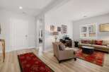Step into this inviting living space, featuring a harmonious blend of comfort and style.