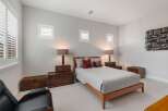 Discover the charm of this inviting bedroom, featuring a cozy bed and stylish decor.