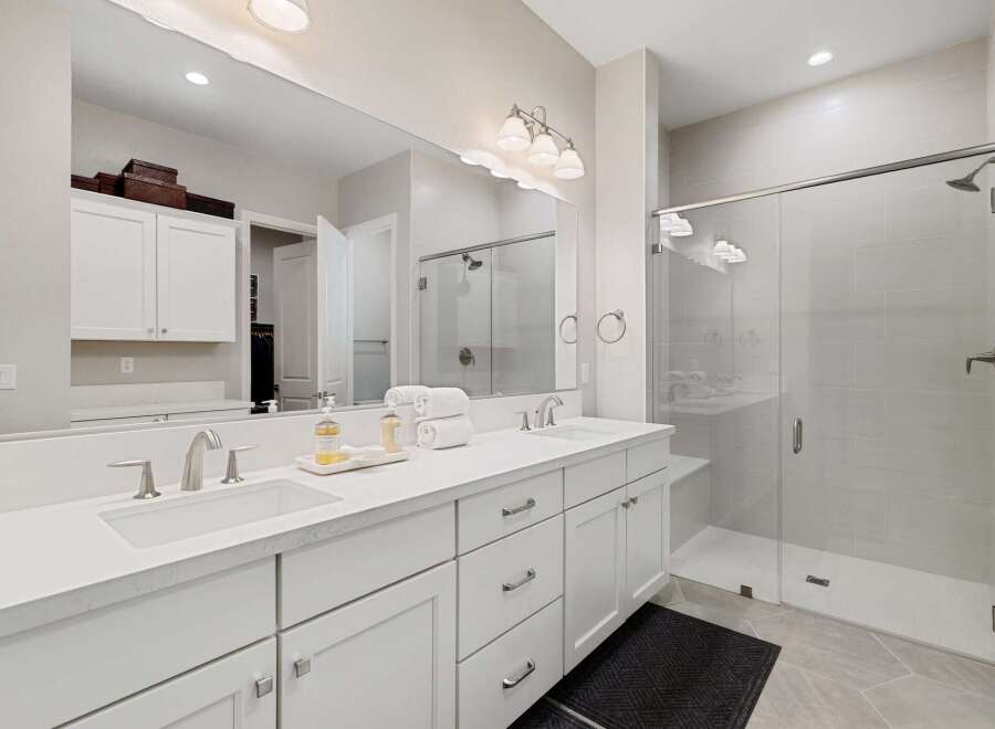Step into luxury with this stunning bathroom featuring a sleek, modern design.