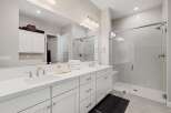 Step into luxury with this stunning bathroom featuring a sleek, modern design.