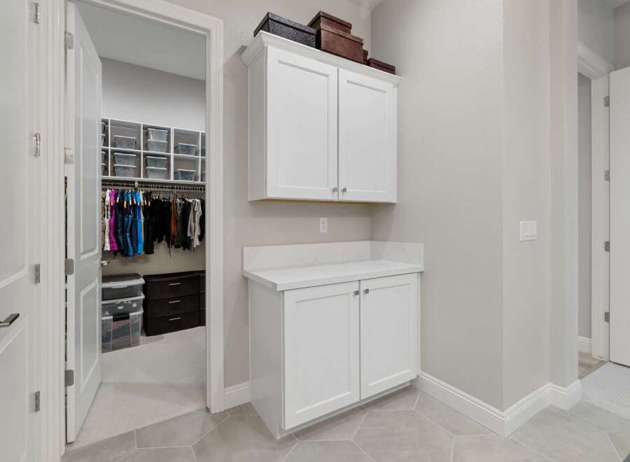 Step into luxury with this stunning property featuring a spacious walk-in closet and ample storage solutions.