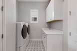 This stunning laundry room boasts modern design and functionality.