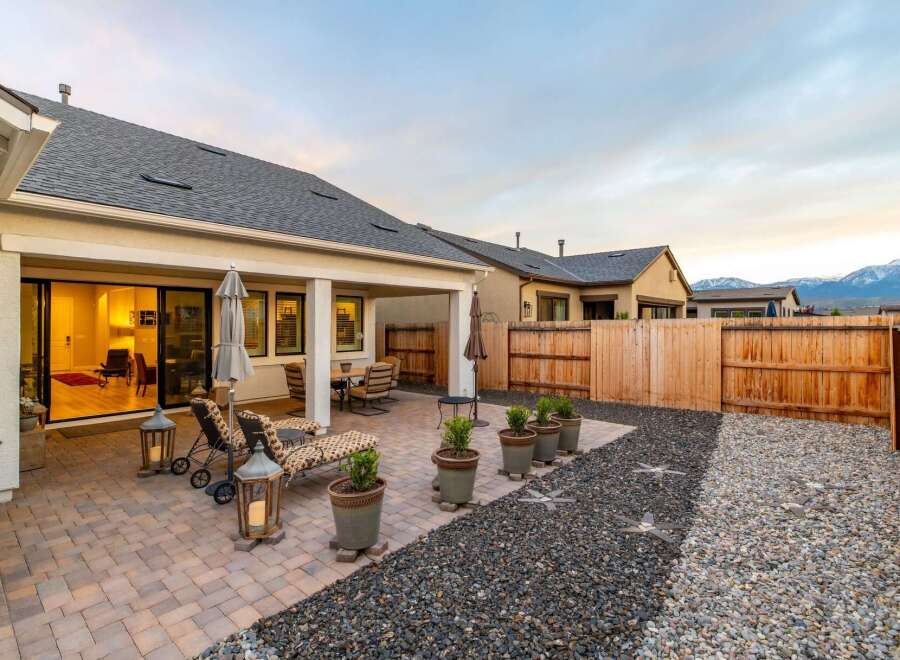 Enjoy outdoor living at its finest in this stunning property! This home features a beautifully designed patio with comfortable seating, perfect for relaxing or entertaining.