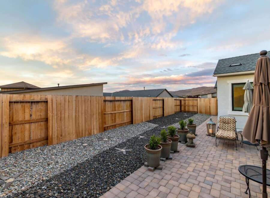 Enjoy the tranquility of this beautifully landscaped backyard.