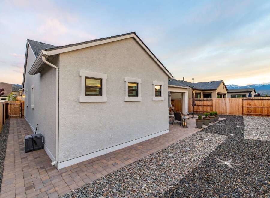 This stunning property boasts a beautifully designed exterior with a modern aesthetic.