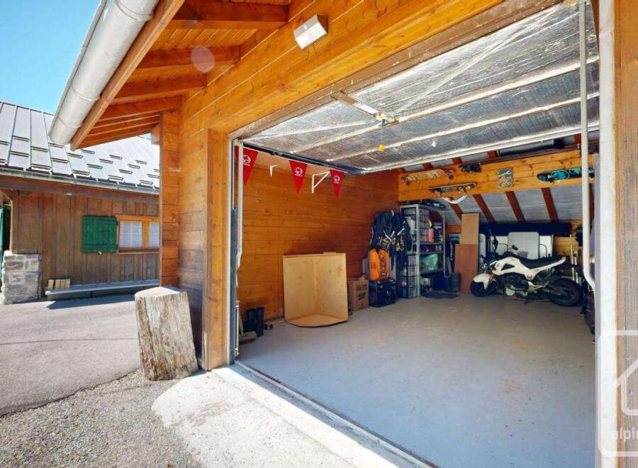 Discover this charming property featuring a spacious garage, perfect for storing vehicles and equipment.