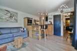 Discover this charming property featuring a cozy living space with a comfortable sofa and a unique wooden stump table.