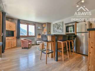 Discover this charming property featuring a cozy living space with wooden floors and a rustic touch.