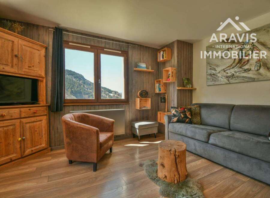 Discover the charm of this cozy property, featuring a rustic interior with wooden accents and a comfortable seating area.