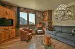 Discover the charm of this cozy property, featuring a rustic interior with wooden accents and a comfortable seating area.