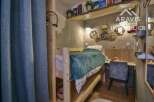 Discover this cozy and stylish bedroom, perfect for a comfortable living experience.