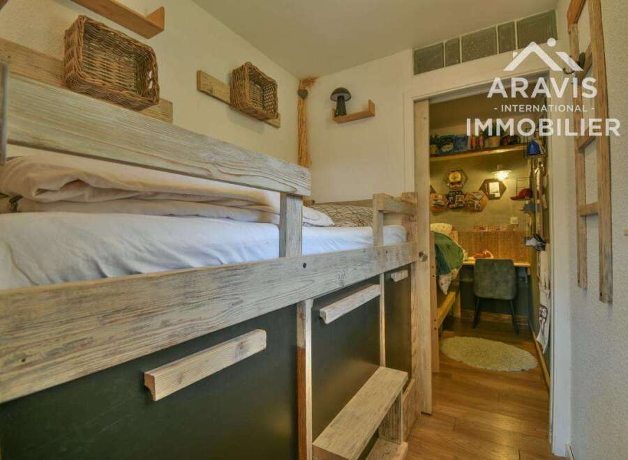 Discover this charming property featuring a cozy bunk bed, perfect for accommodating guests or family.