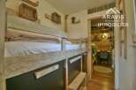 Discover this charming property featuring a cozy bunk bed, perfect for accommodating guests or family.