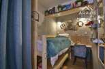 Discover this cozy and stylish bedroom, perfect for a comfortable living experience.