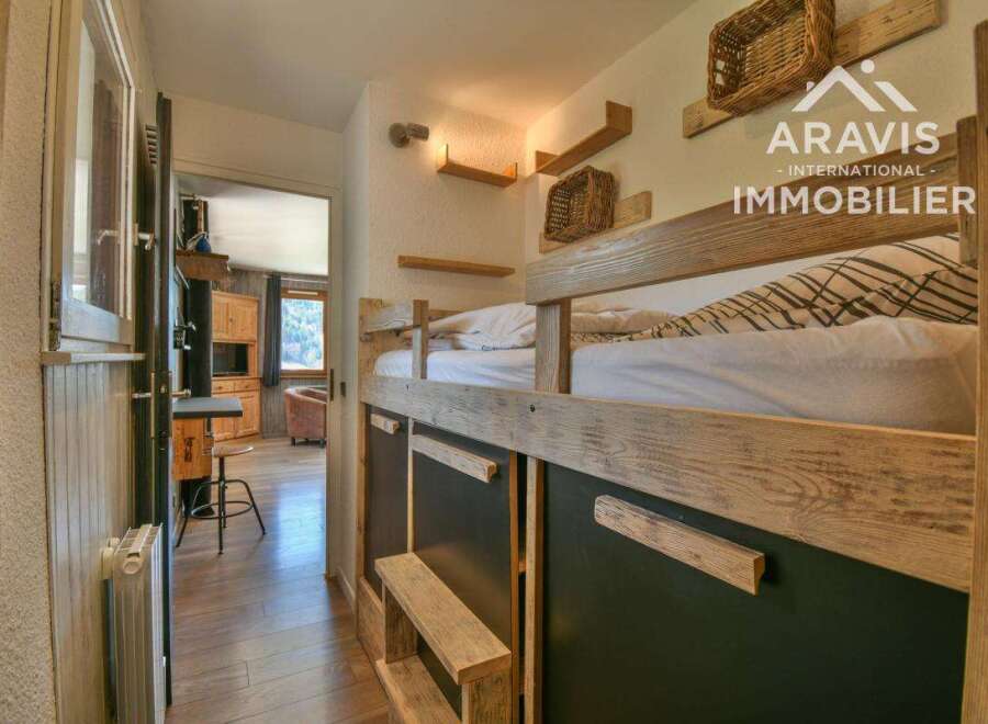 Discover this charming property featuring a cozy bunk bed setup, perfect for family or guest accommodations.
