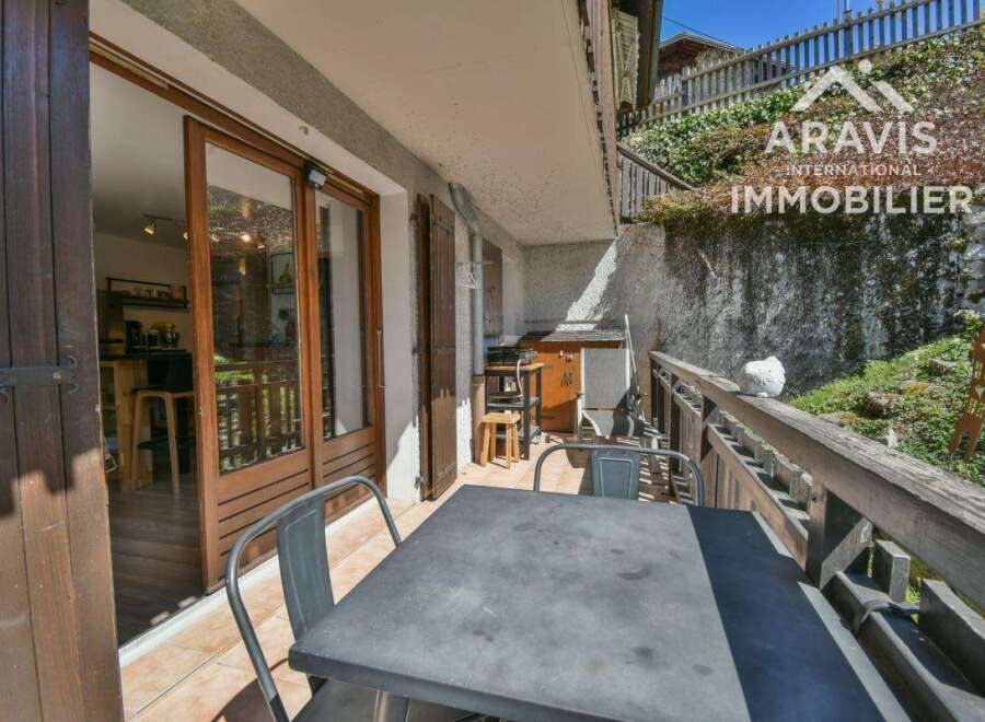 Enjoy the charm of this property featuring a balcony with a table and chairs, perfect for outdoor dining.