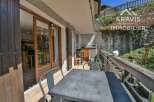 Enjoy the charm of this property featuring a balcony with a table and chairs, perfect for outdoor dining.