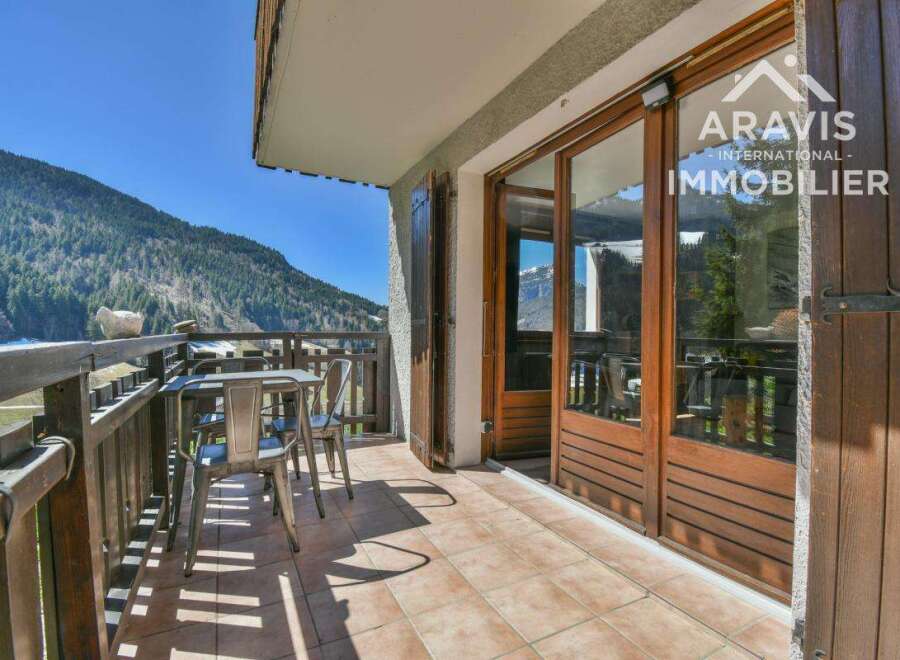 Enjoy breathtaking mountain views from this charming balcony.