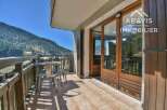 Enjoy breathtaking mountain views from this charming balcony.