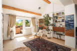 This stunning living space boasts a bright and airy atmosphere, perfect for relaxation and entertaining.