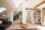 Discover the charm of this stunning property, featuring a bright and airy living space with a unique architectural design.
