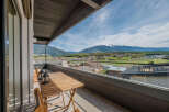 Enjoy breathtaking mountain views from this stunning balcony.