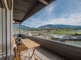 Enjoy breathtaking mountain views from this stunning balcony.