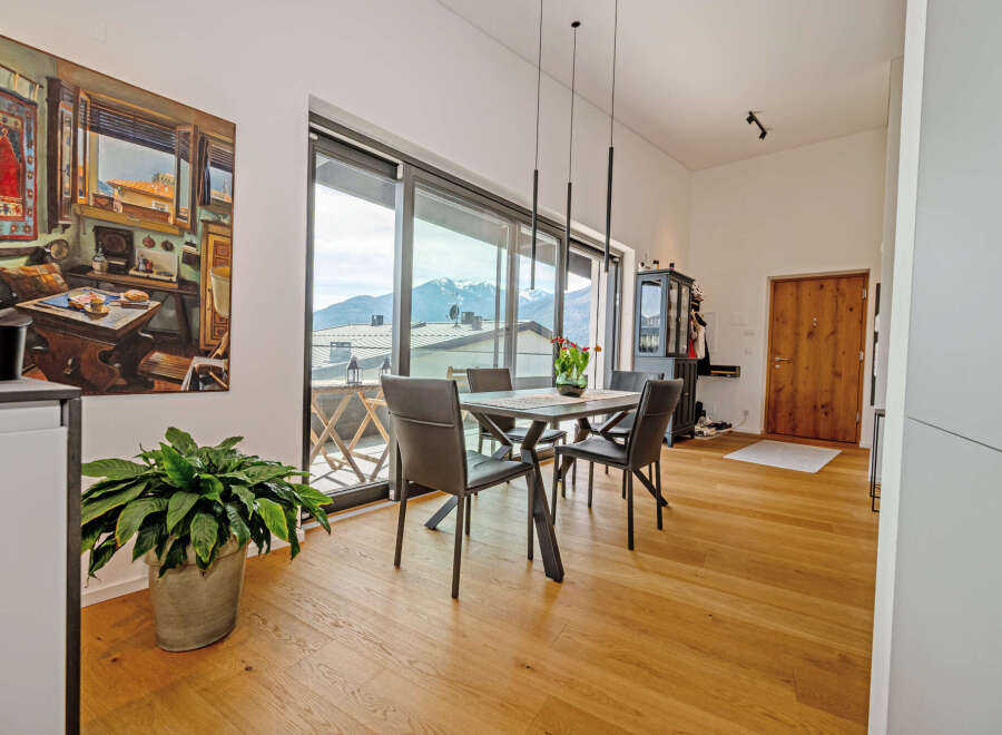 Experience luxury living in this stunning property, featuring a bright and airy dining area with breathtaking mountain views.