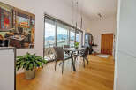 Experience luxury living in this stunning property, featuring a bright and airy dining area with breathtaking mountain views.