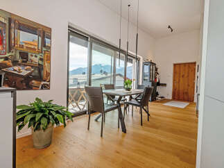 Experience luxury living in this stunning property, featuring a bright and airy dining area with breathtaking mountain views.