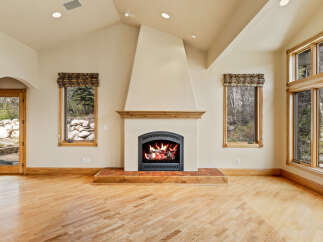 This stunning living space features a cozy fireplace, perfect for chilly evenings.