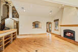 This stunning property boasts a spacious living area with a cozy fireplace, perfect for relaxing evenings.