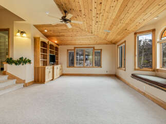 This stunning property boasts a spacious interior with a warm and inviting atmosphere.