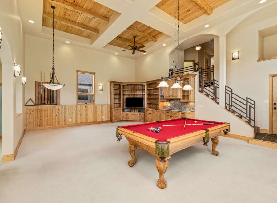 This stunning property boasts a luxurious game room, perfect for entertaining and relaxation.