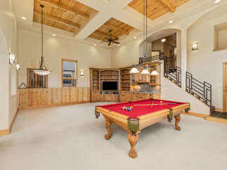 This stunning property boasts a luxurious game room, perfect for entertaining and relaxation.
